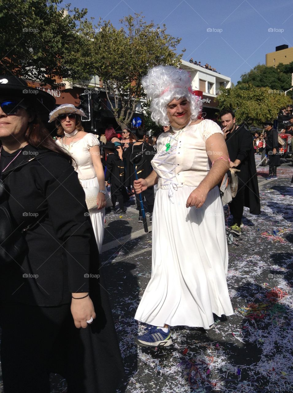 Man dressed as a woman in carnival parade.