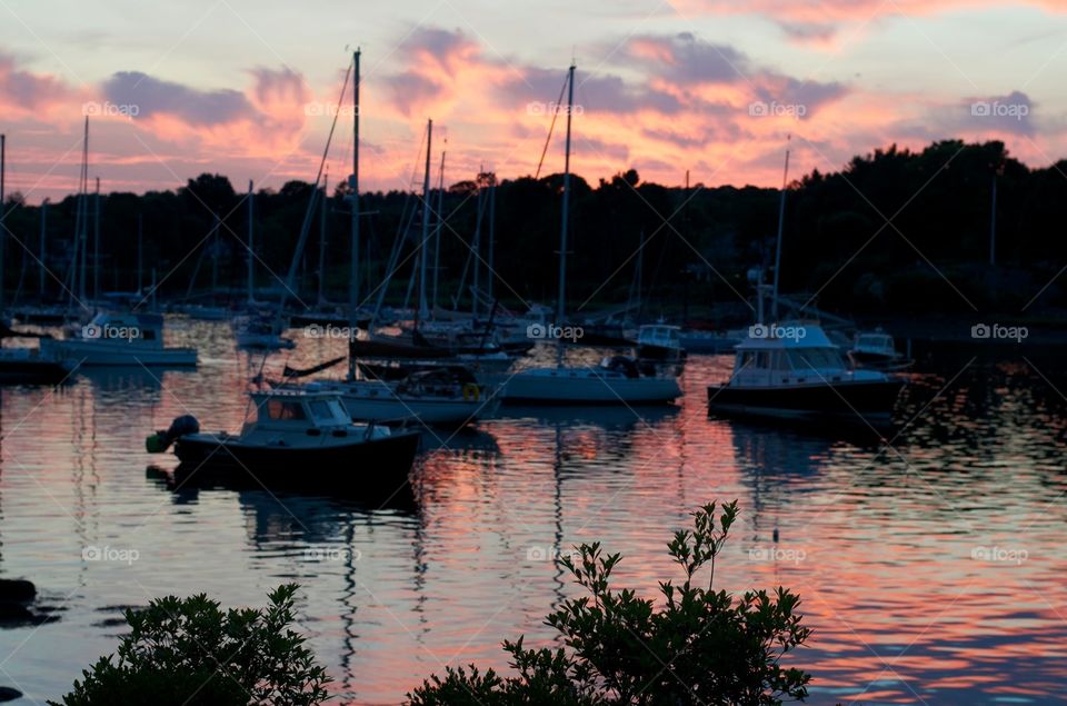 sunset sailboats. sitting on the dock 