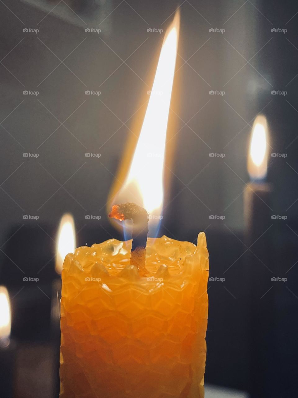 Candle burning in the dark