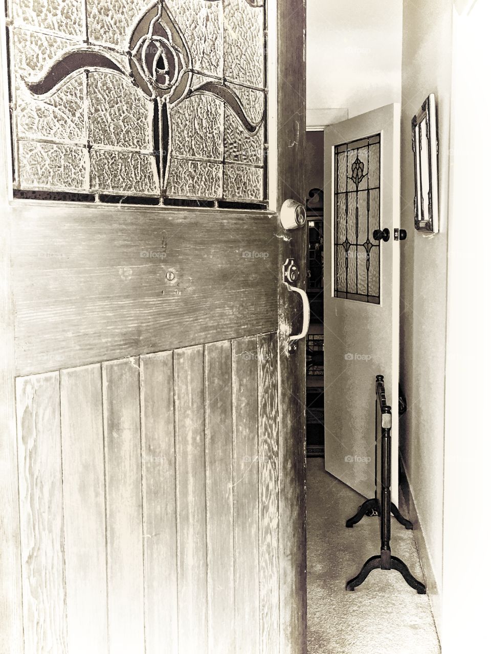 Antique stained glass door, opening into home