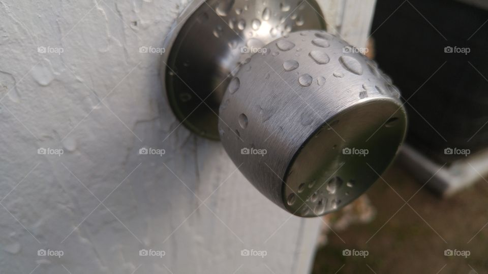 Wet Silver Doorknob/Doorknob After a Rainy Day.