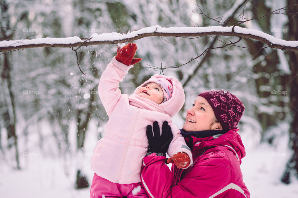 Winter with friends. Spending wintertime outdoors playing with snow