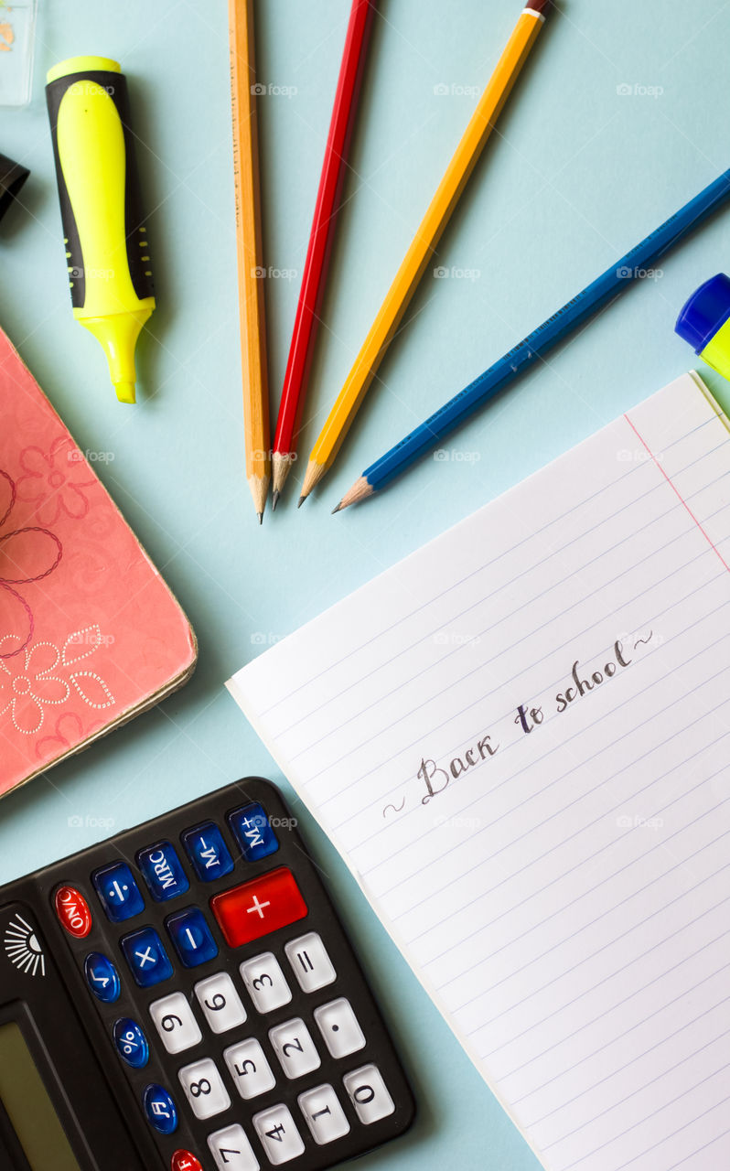 notebook, pencils and marker