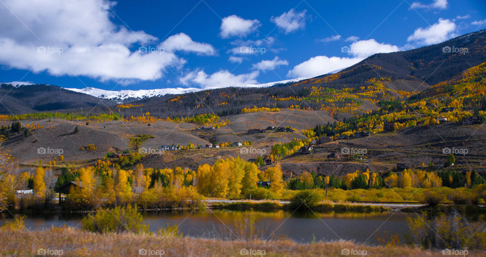 View of rocky mountain against cloudy sky