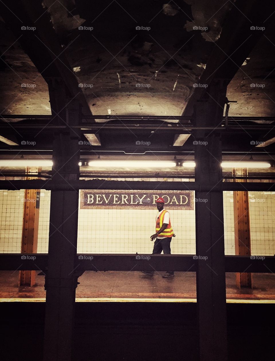 Working man walks in Bervely Road subway station in New York 