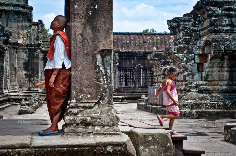 Angkor Wat Juxstaposition. Half prayer half play, an utter juxtaposition of pensive thought and mindless play :)