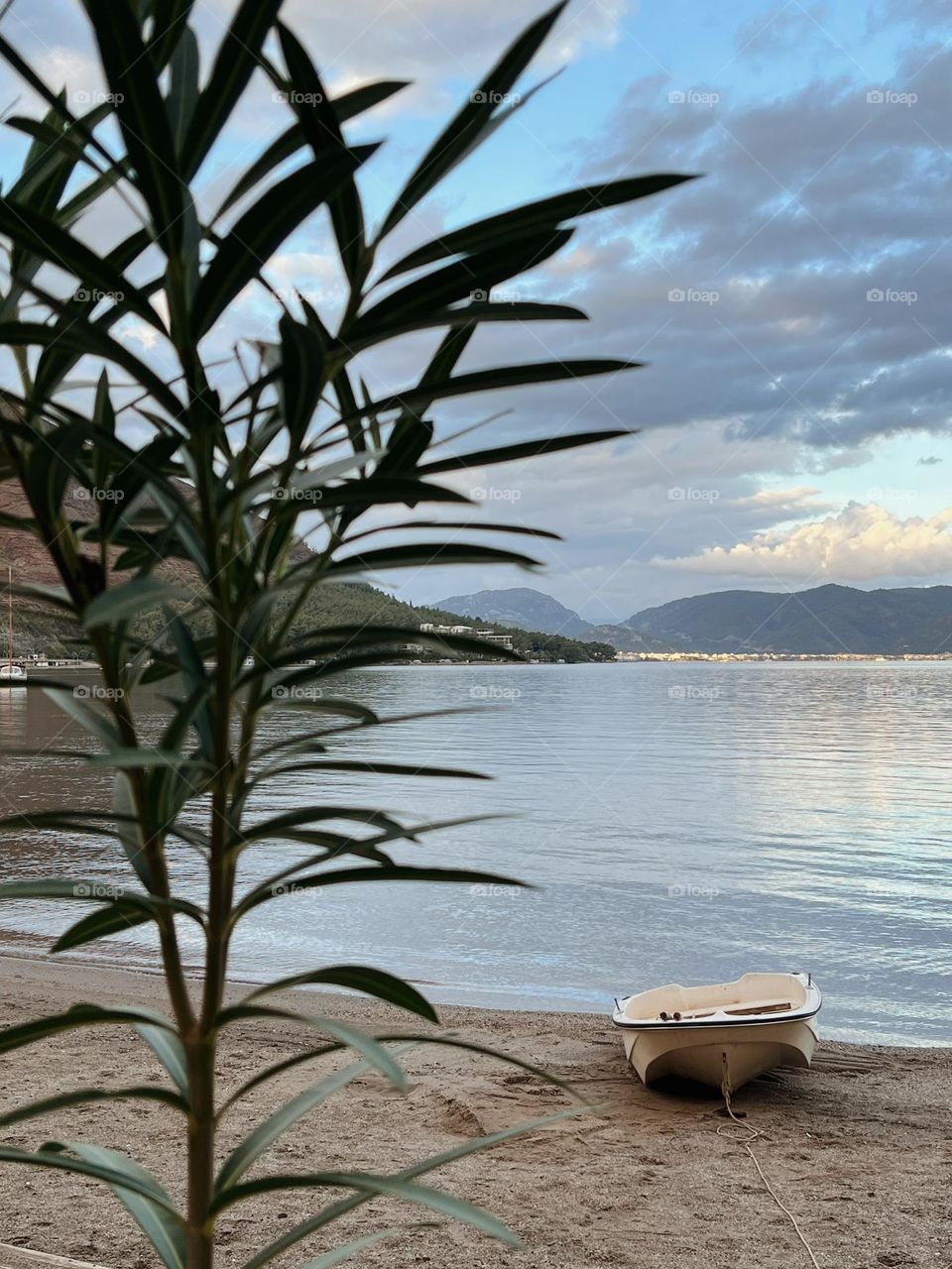 Lone boat on the sandy beach 