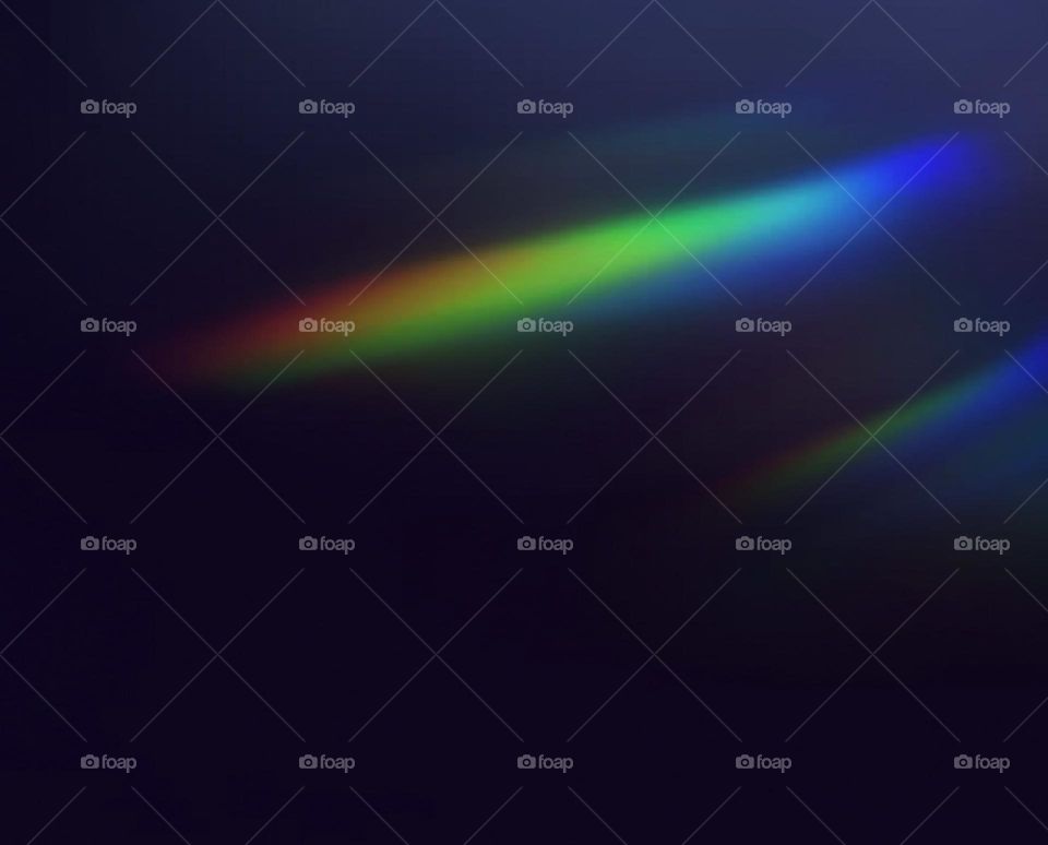 Photography of rainbow. Rainbow on black background.  Abstract web background. Banners and panels. Design background. Computer. Desktop background and design. Unique. Surrealistic. Dispersion of light