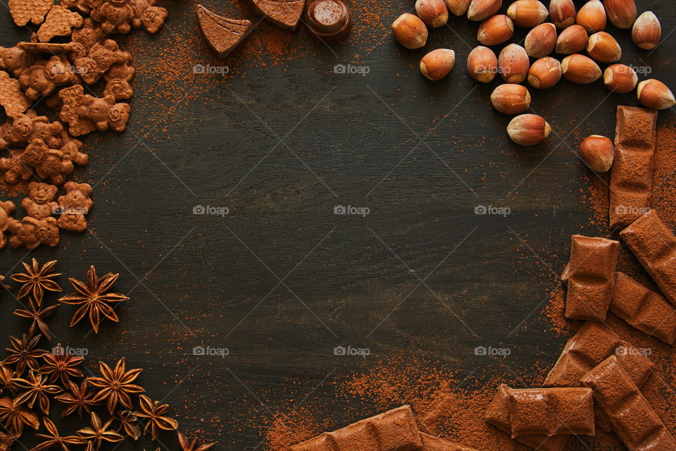 Chocolate cookie and cinnamon on table