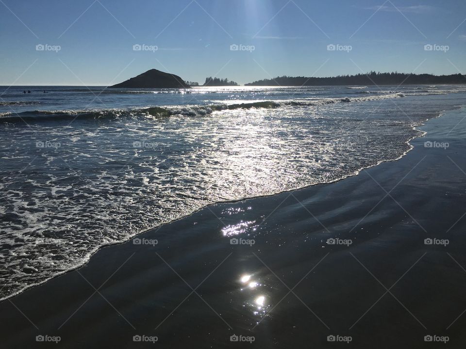 Scenic view of a beach against clear sky