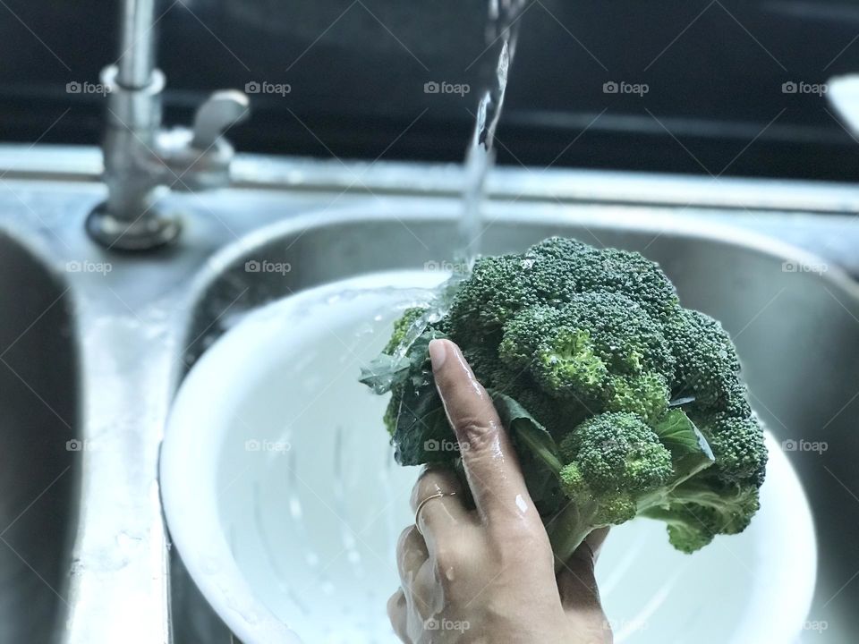 Broccoli under running water 