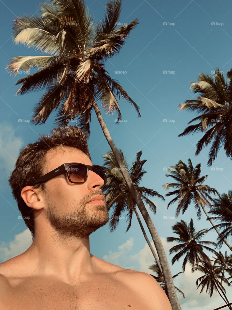 Man at the beach palmtree