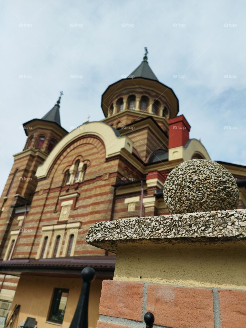 Cement ball of a Church fance