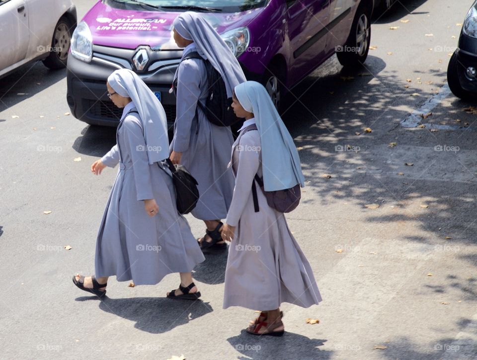 Three nuns. Nuns crossing a street in Rome. 