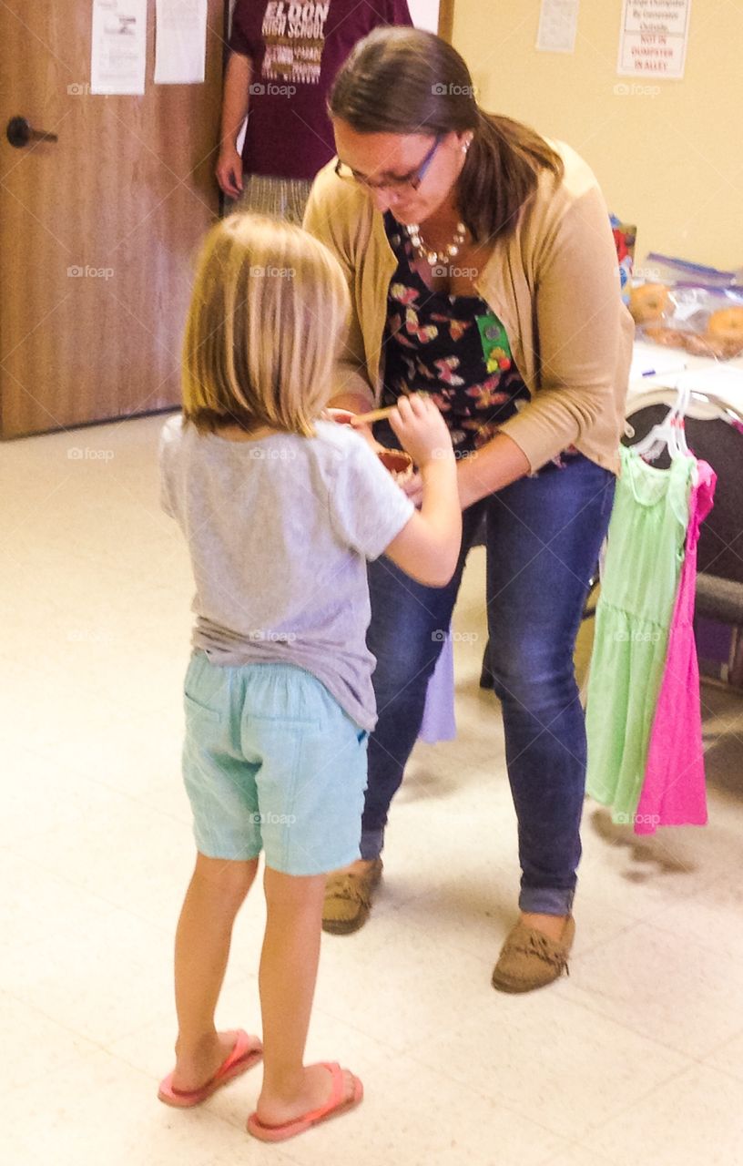 My wife helping one of her Girl Scouts.