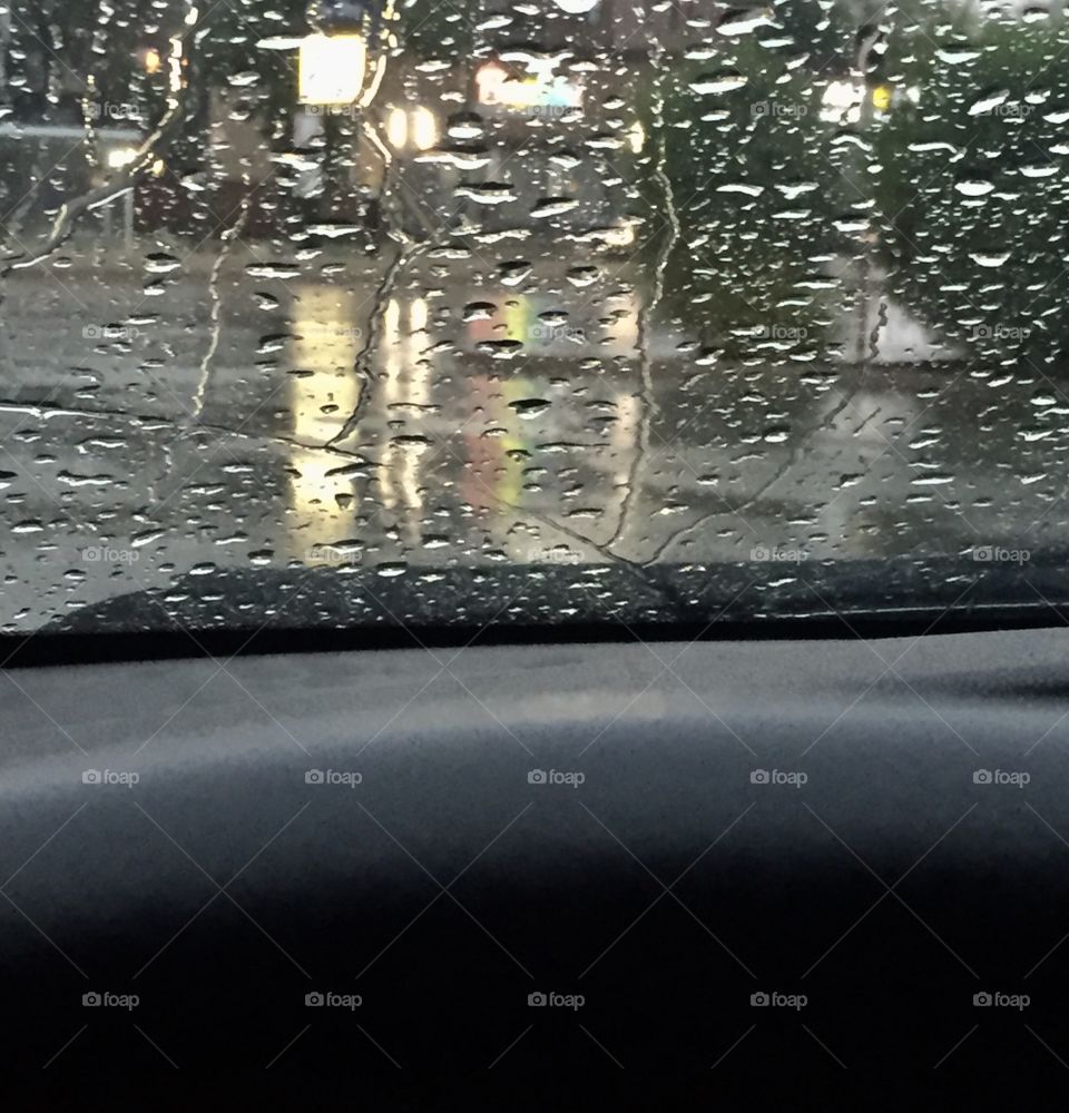 Rain drops on the windshield on a rainy eve  