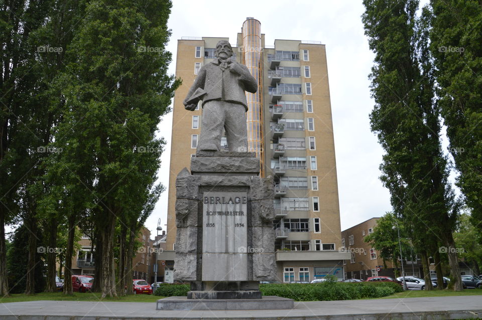 Belage Statue And Flatbuilding