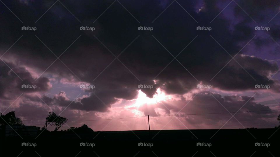 beautiful red sunrise / sunset on a warm summer day. a storm is coming.