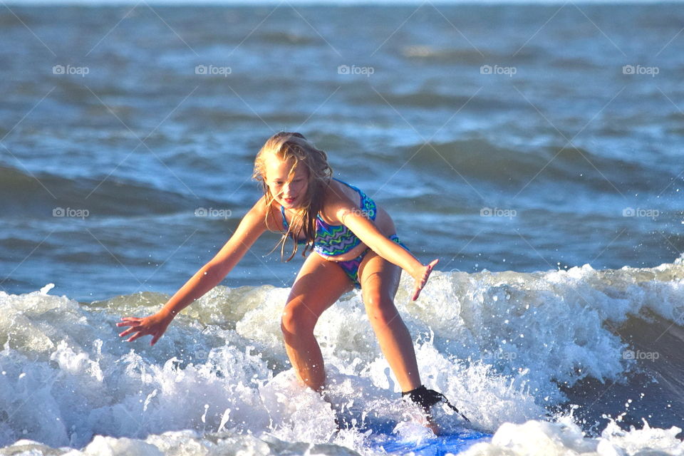Surfer Wannabe. My daughter learning to surf in Hilton Head