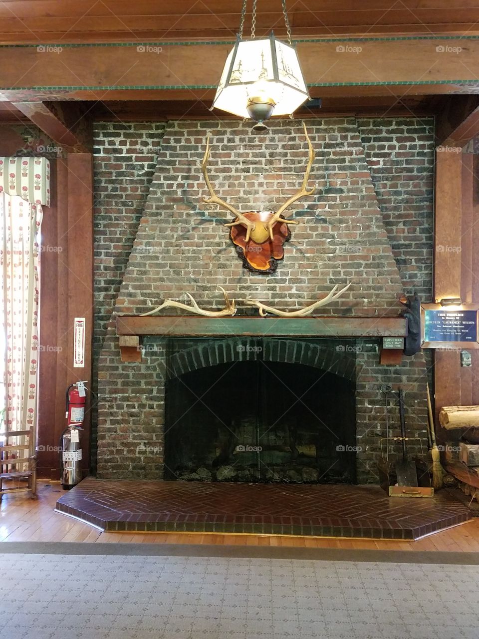 A grand fireplace at a lodge