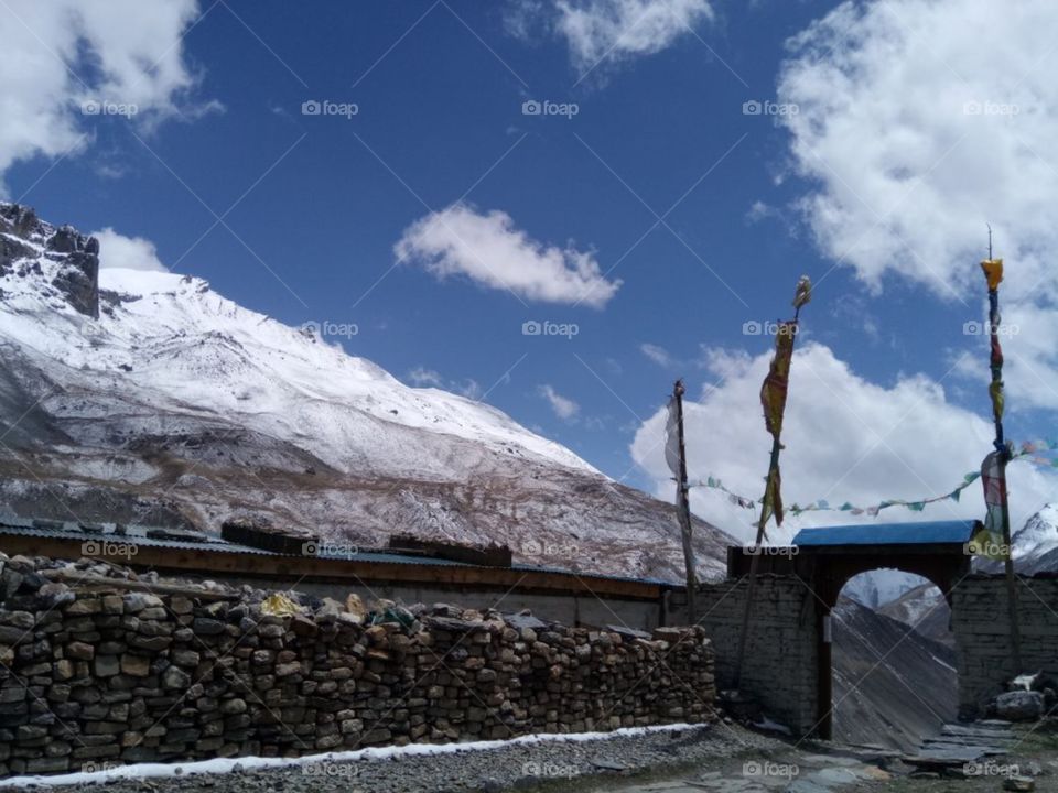 this reflects actual the mountain sizes of the Nepal and with the clear weather of white clouds sun rays are falling on the mountains the actual culture of Nepal even that the stones which are used for making the big houses