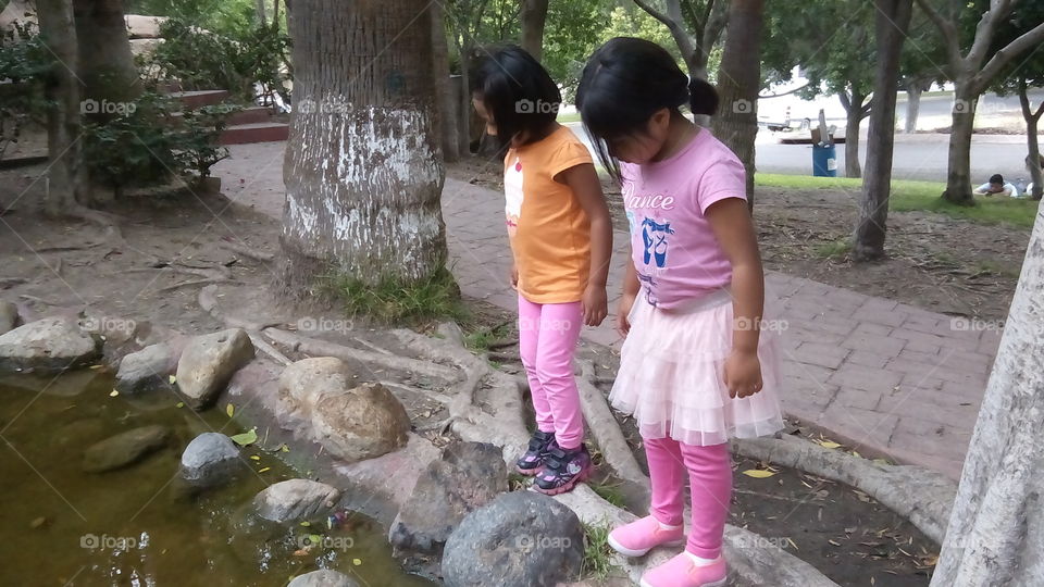 Finding Fishes.. Two girls finding fishes.