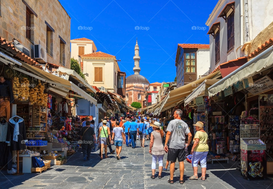 Street market at town Rhodes. Street market that leads to the famous landmark mosque in old town of Rhodes, Rhodes island, Greece, Europe.
