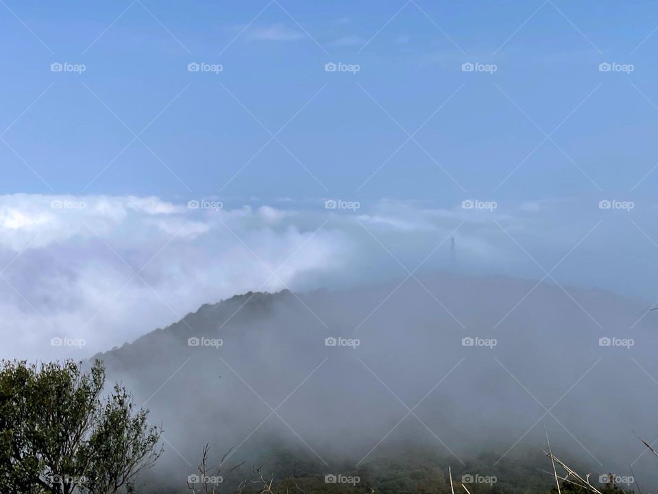 surrounded by clouds