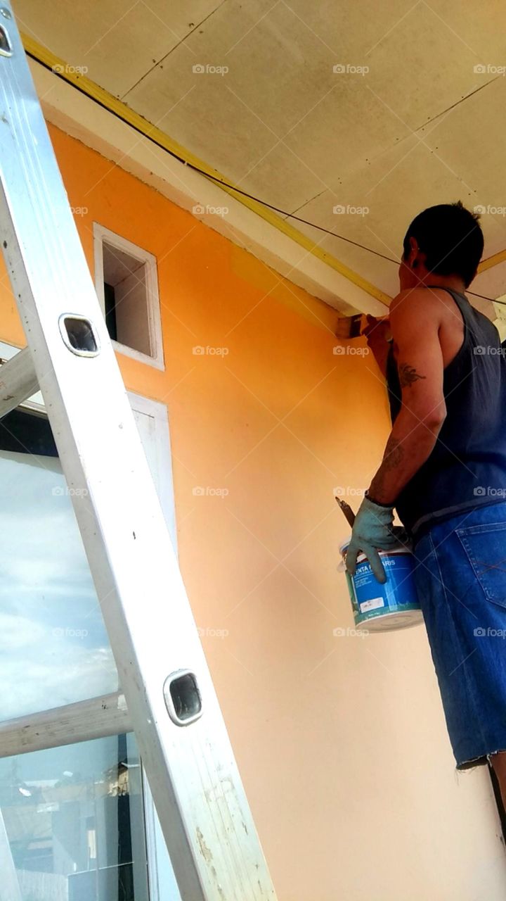 Repainting wall balcon, re-new the old paint.