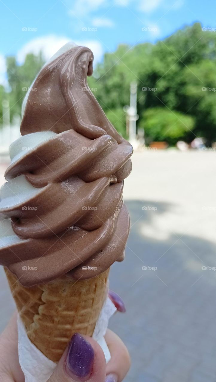 Summer, the sun, a walk in the park, my ice cream melting in the sun, I need to eat it right now, ice cream in a cone, chocolate ice cream, summer