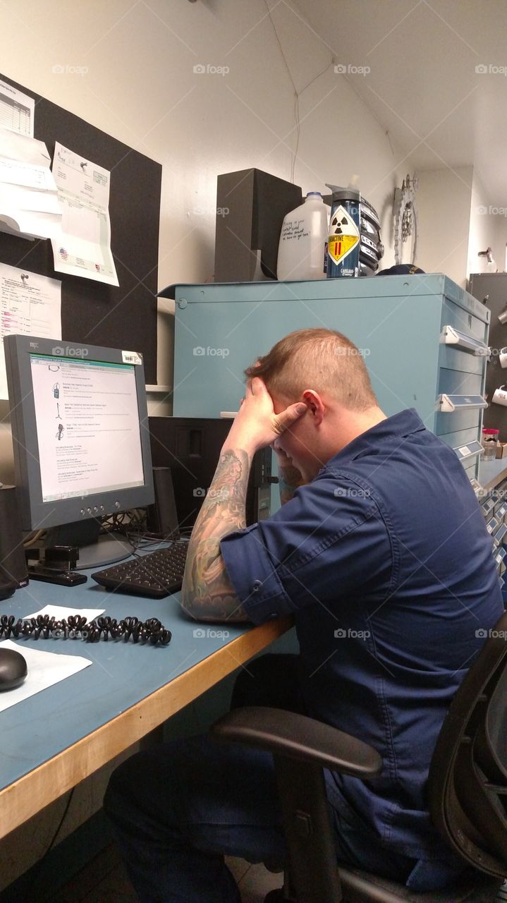 Tough day at the Job. My friend and shipmate in the U.S. Coast Guard was having trouble finding the right parts, and I couldn't pass the opportunity of catching his frustration!