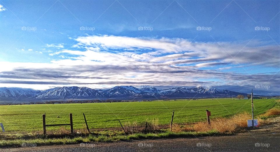 Utah farmland with snowy mountains