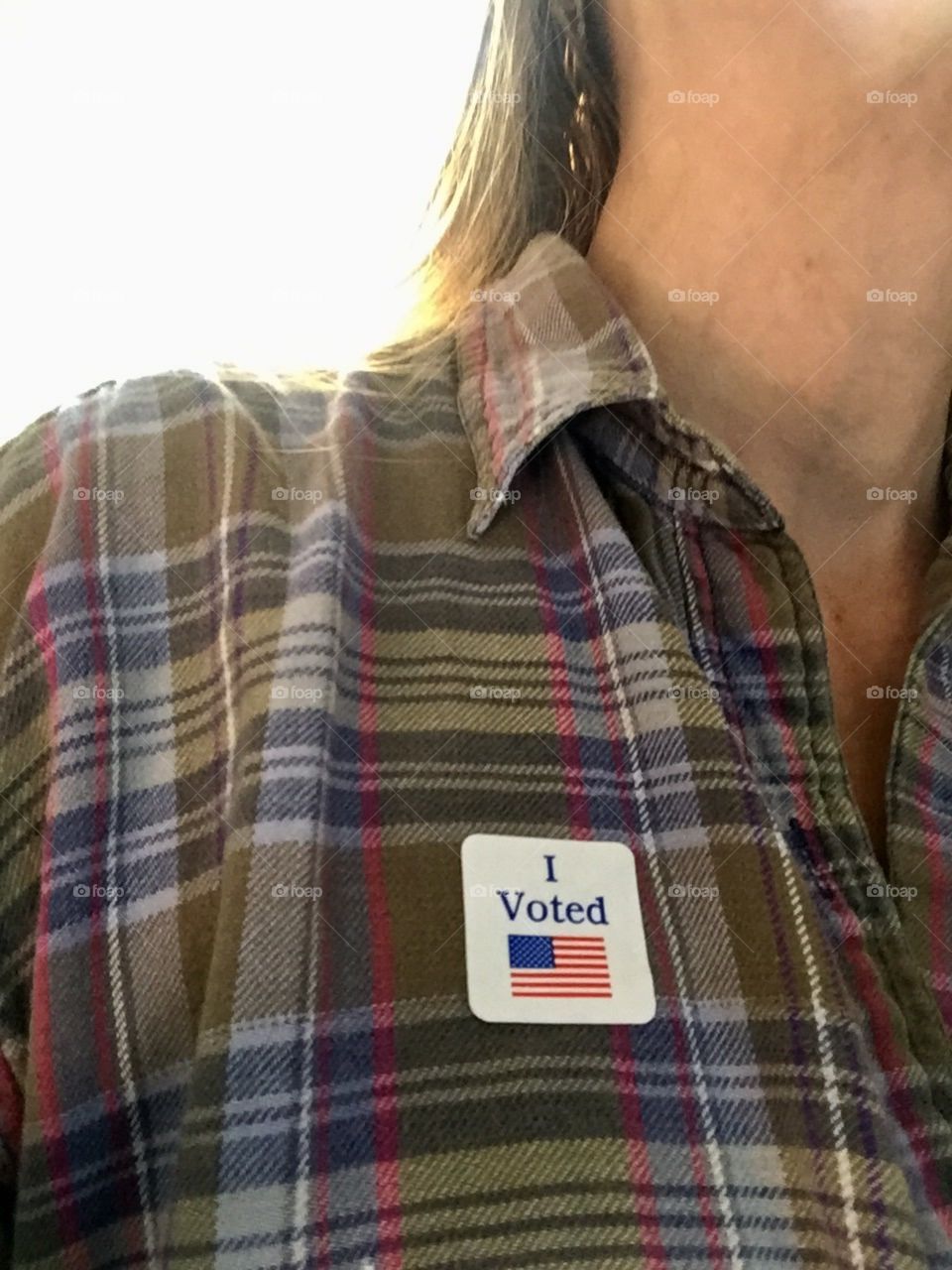 Woman wearing an I voted sticker 