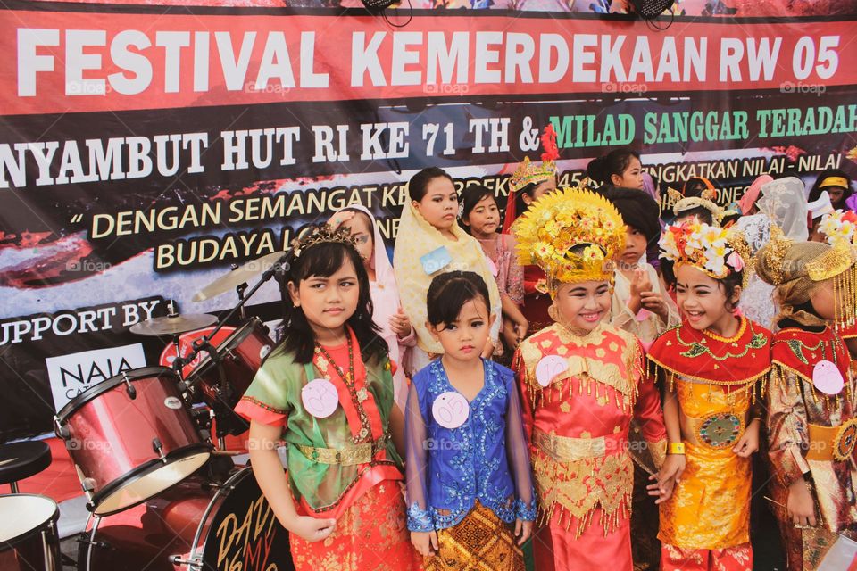 performance with traditional costumes, in the context of regional art competitions in Indonesia.