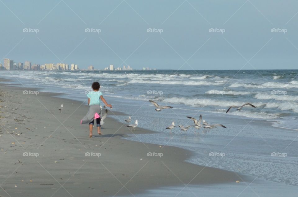 Girl Running on Beach