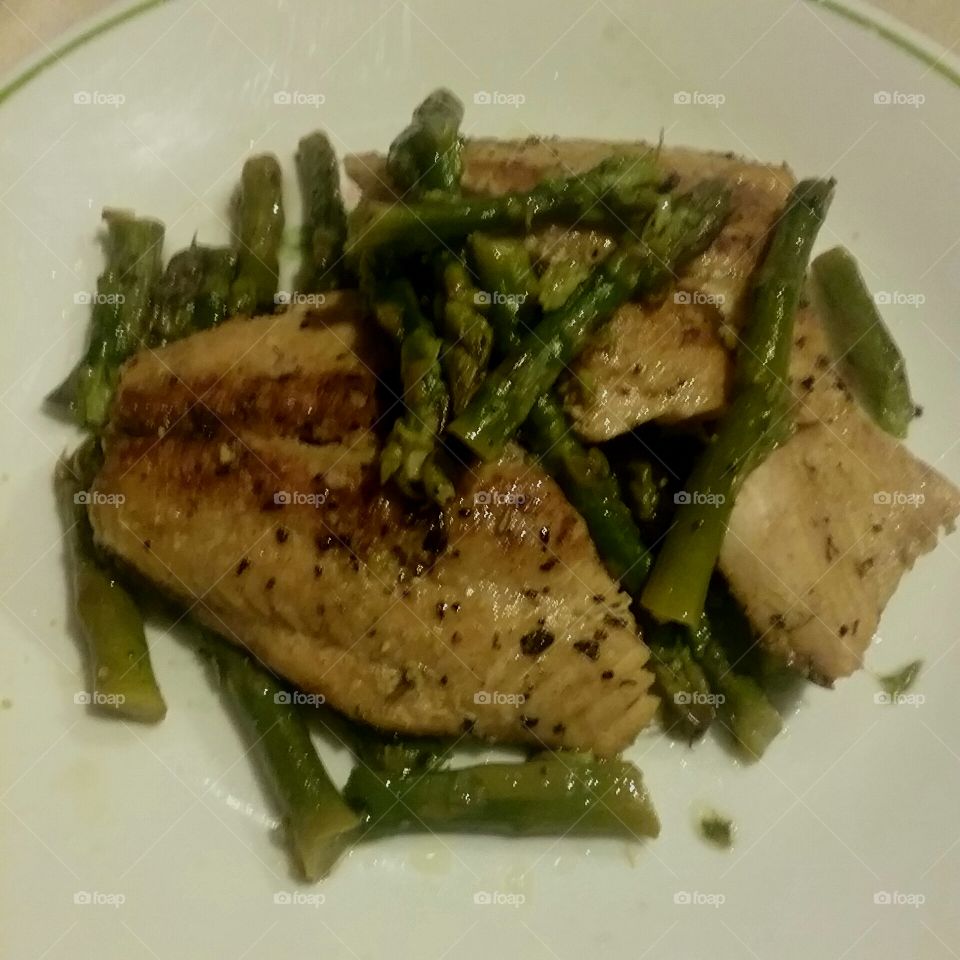 lemon pepper grilled salmon and asparagus cooked in coconut oil