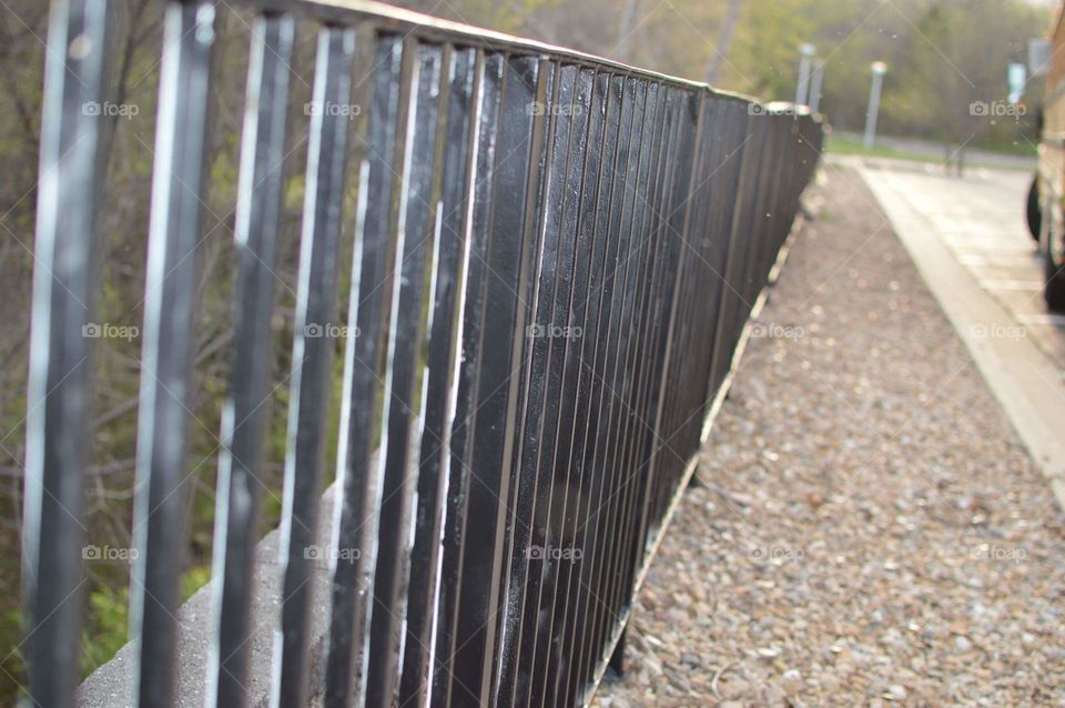 fence and sidewalk stones