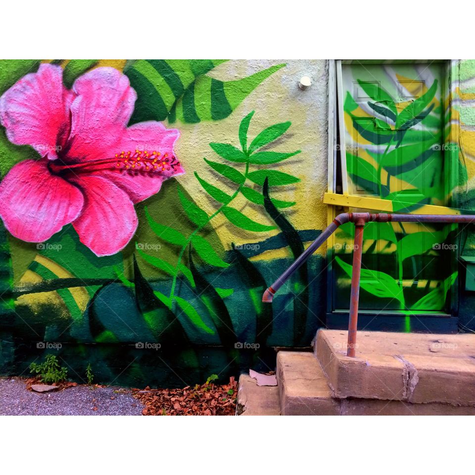 Tropical design, mural Baltimore wall art flowers green leaves 