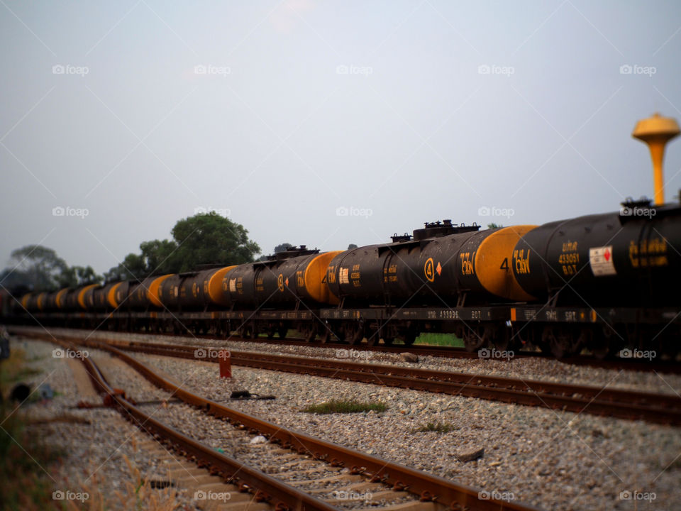 Oil and gas tanks being transported by train.