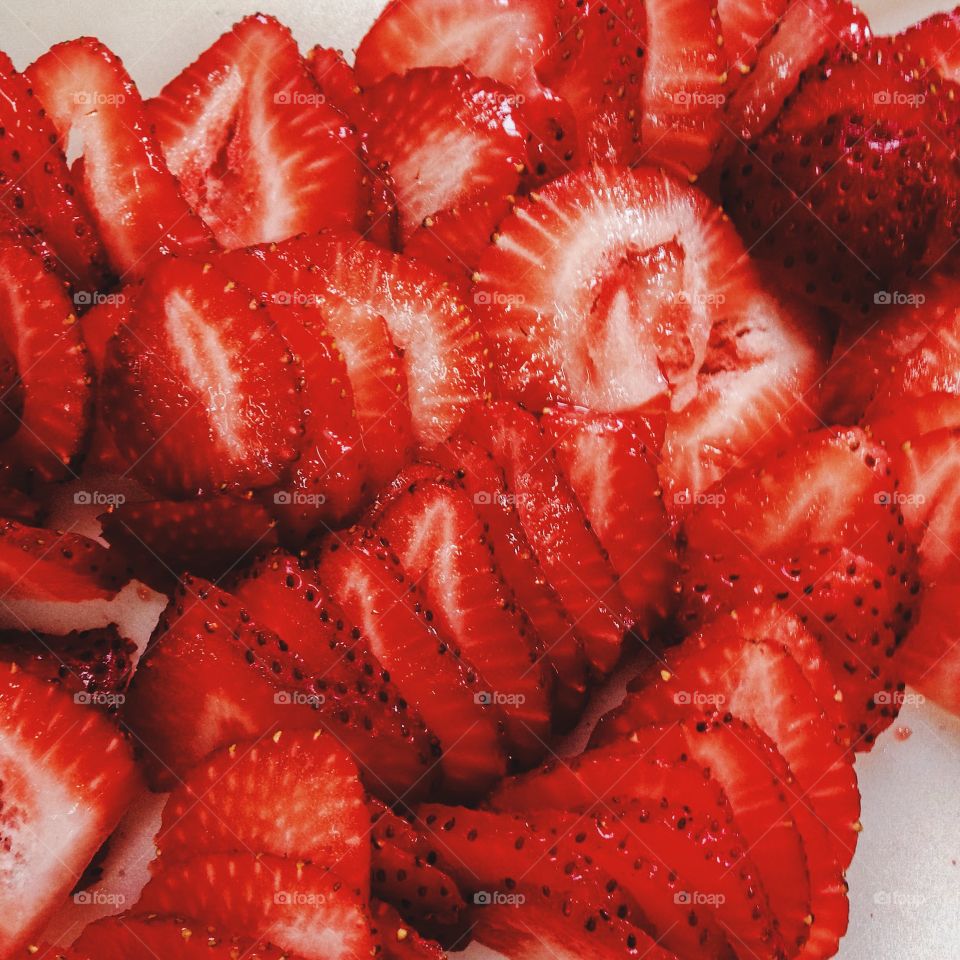 Strawberries . Cut strawberries 