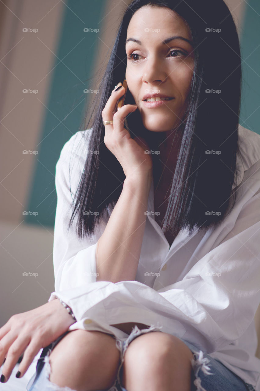 Close-up of a woman talking on mobile phone