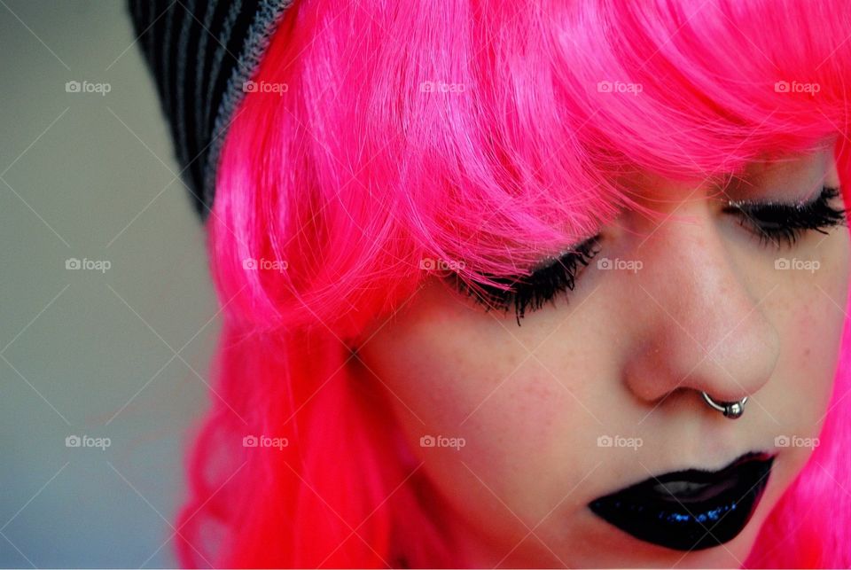 Dyed pink hair with dark lipstick