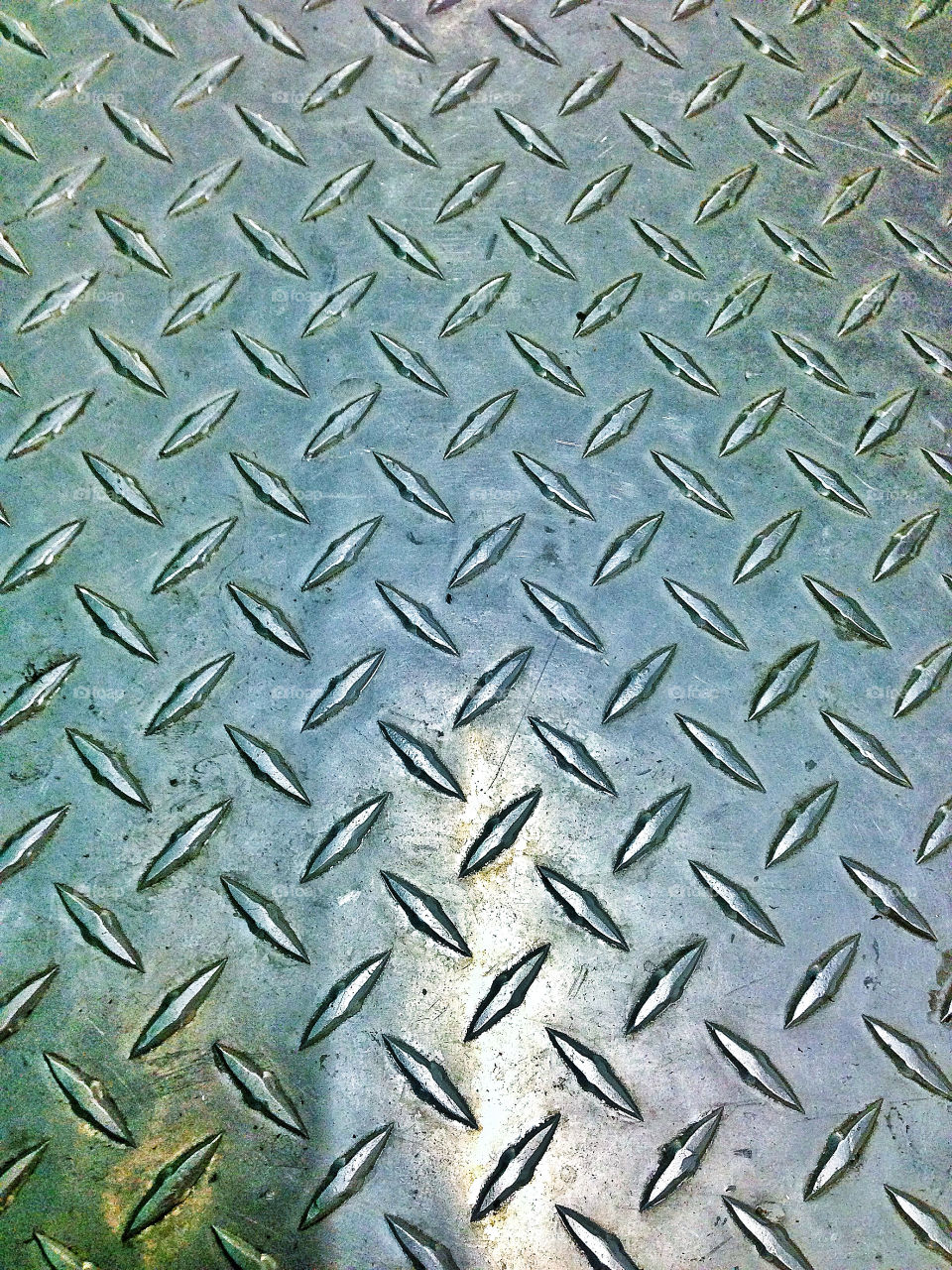 Anodized steel floor plating with cross-hatched grid pattern