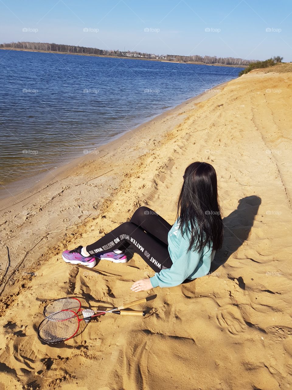 girl with black hair on the shore