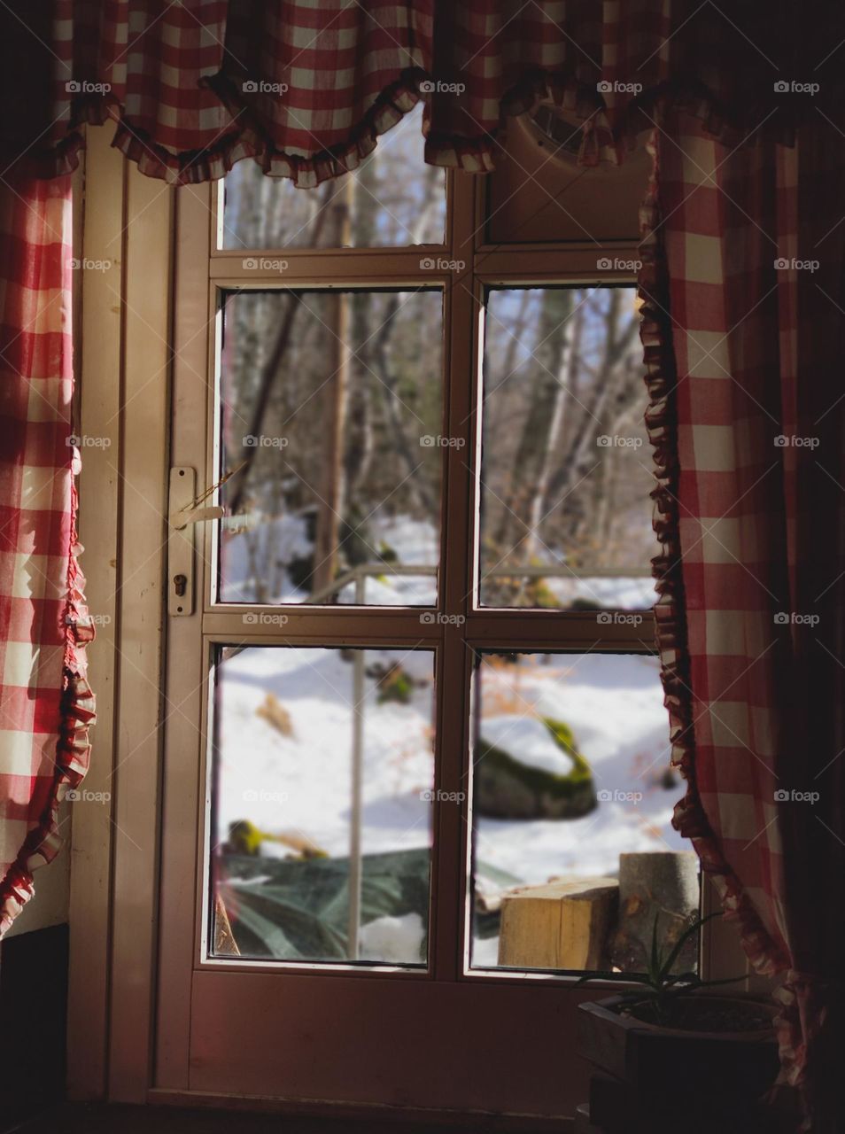 Cozy winter in a window frame