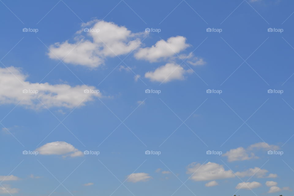 Clear blue sky with white clouds 