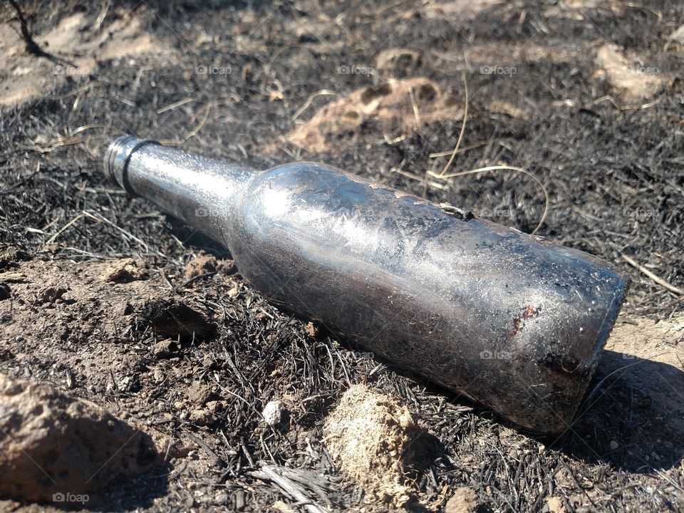 Close up of a black bottle.