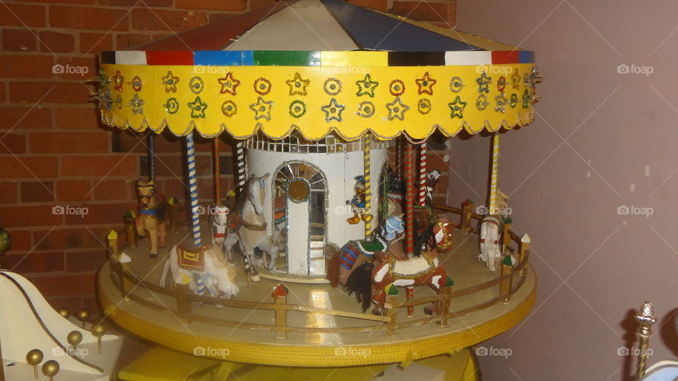A small carousel with horses