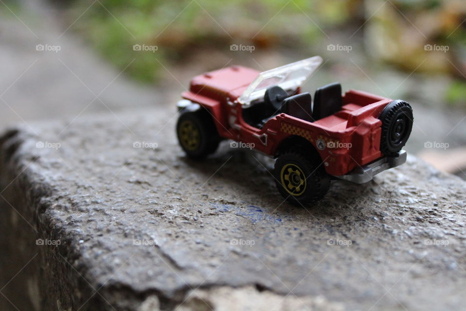 red Jeep on concrete