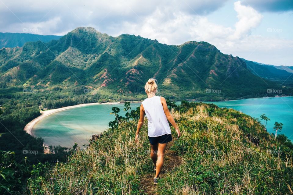 Blonde hiker on crouching lion hike on Oahu, Hawaii. 